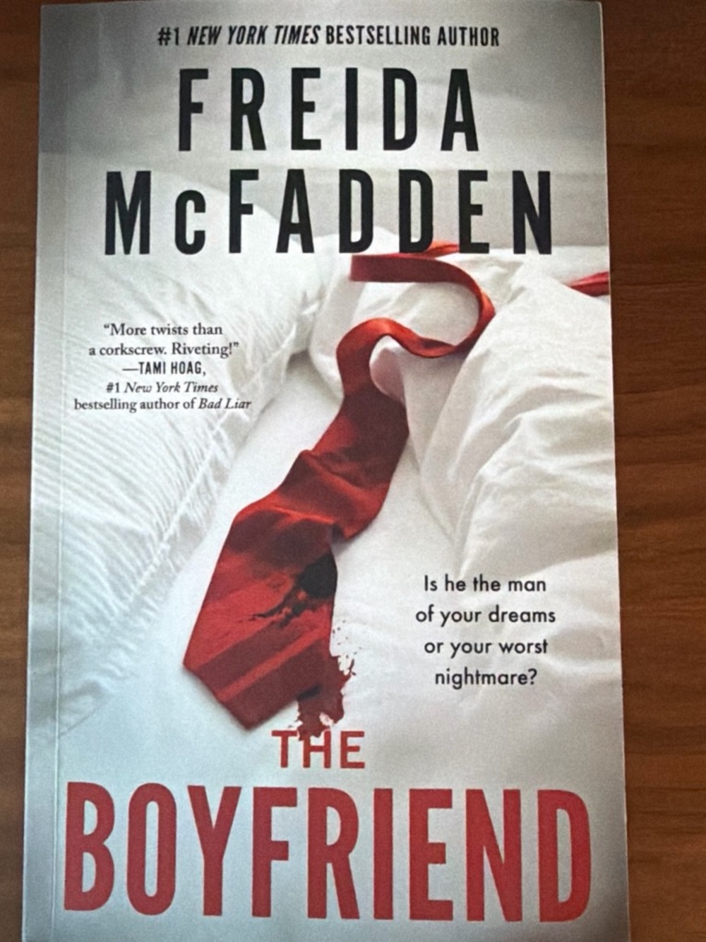 The Boyfriend by Freida McFadden - Paperback Thriller with Red Tie Cover